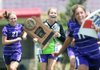 Central Arkansas Christian goalkeeper Shelby Richburg (middle) celebrates with teammates while holding the Class 5A girls championship trophy after the Lady Mustangs’ 1-0 victory over Little Rock Christian. 