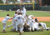 Shiloh Christian players celebrate Saturday after the final out of the Saints’ 4-0 win over Lonoke in the Class 4A state championship at Baum Stadium. The Saints will voluntarily move to the 5A classification over the next two years.