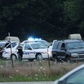 Fayetteville Police approach a black Chevrolet Tahoe on Thursday after being seen arresting someone ...