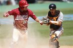 Arkansas’ Matt Vinson (left) and Sam Houston State catcher John Hale react after Vinson scored the tying run during the seventh inning at the NCAA Houston Regional on Friday. Arkansas scored three runs in the inning and won 5-4. The Razorbacks will play Rice today.