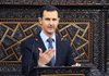In this photo released by the Syrian official news agency SANA, shows Syrian President Bashar Assad, as he delivers a speech at the parliament in Damascus, Syria, Sunday, June 3, 2012. The president's first comments on the massacre expressed horror over the deaths of more than 100 people, nearly half of them children. U.N. investigators say there are strong suspicions that pro-government gunmen carried out the killings, but Assad denied that. (AP Photo/SANA)