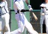 D’Vone McClure hits a two-run home run Friday at Tyson Sports Complex in Springdale. McClure was offered a scholarship by the University of Arkansas and was drafted by the Cleveland Indians. 