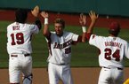 Arkansas players Dominic Ficociello (center), Jake Wise (left) and DJ Baxendale celebrate after defeating Baylor 5-4 Sunday in Game 2 of the NCAA super regional in Waco, Texas. The two teams play again today, with the winner advancing to the College World Series. 