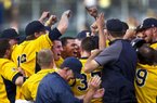 Kent State celebrates their 3-2  win over Oregon in an NCAA Super Regional Monday June 11, 2012  to advance to the College World Series.(AP Photo/The Oregonian,  Ross William Hamilton )