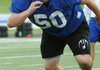 Zane Bush, a Rogers junior offensive guard, runs a blocking drill Wednesday during an offensive line camp at Mountie Stadium in Rogers.