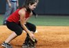 Ashley Ferguson of Rogers High and a West All-Star selection scoops up a ground ball against the East All-Stars during the game Monday at Bogle Park in Fayetteville.