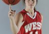 Breanna Jones of Farmington spins a basketball on her finger during the Arkansas High School Coaches Association All-Star week kickoff Sunday at Barnhill Arena in Fayetteville.