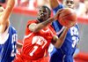 Nate Griffin of Benton tries to get to the basket while being defended by Austin Brown (left) of Heber Springs and Warren Boyd of Marion during the All-Star boys basketball game in Bud Walton Arena in Fayetteville on Wednesday, June 20, 2012.