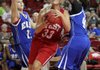 Caroline Eubanks of Springdale Har-Ber, center, drives through Emily Johnson of Calico Rock, left, and Shabr’an Richardson of Dumas on Wednesday at Bud Walton Arena for the Arkansas High School Coaches Association All-Star girls basketball game.