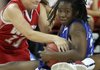 Breanna Jones, left, of Farmington tries to wrestle the ball from Sandy Jackson of North Little Rock on Wednesday at Bud Walton Arena for the Arkansas High School Coaches Association All Star girls basketball game.