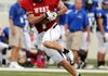 Brad Culp of Fayetteville turns with the ball after a catch that leads to a first quarter touchdown against the East in the All-Star game Thursday at Razorback Stadium in Fayetteville. 