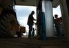 Customers pump fuel Friday afternoon at the Valero station at 925 Fair Park Blvd. in Little Rock. 