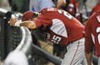 Arkansas' Dominic Ficociello (25) stands dejected after losing 3-2 to South Carolina in an NCAA College World Series baseball elimination game in Omaha, Neb., Friday, June 22, 2012. South Carolina won 3-2 and advances to play Arizona in the championship series. (AP Photo/Eric Francis)
