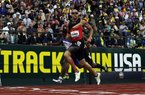 Former Arkansas Razorbacks runner Wallace Spearmon of Fayetteville crosses the finish line in Saturday’s 200-meter semifinal at the U.S. Olympic Track and Field Trials in Eugene, Ore. Spearmon finished seventh with a time of 20.59 seconds and advanced to today’s final. 