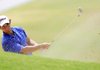 Searcy’s Connor Murphy hits out of a fairway bunker on the 18th hole during Tuesday’s opening round of the Stacy Lewis AJGA Junior Open in Bella Vista. Murphy shot a 78 on Tuesday. 