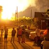 100 flee Ohio rail-car explosions