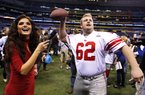 New York Giants offensive guard Mitch Petrus throws during Media Day for NFL football's Super Bowl XLVI Tuesday, Jan. 31, 2012, in Indianapolis. (AP Photo/Michael Conroy)