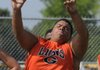 Gravette’s Marcus Adams throws an 11-pound medicine ball Saturday during the 4 States Sports Lineman Challenge in Gravette. Linemen from Gravette and Clarksville competed in events like bench press, sled pull and medicine ball throw. 