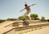 Arkansas Democrat-Gazette/RYAN MCGEENEY --07-20-2012-- Jared Metzger of Rogers grinds along the steel corner of a cement embankment Friday afternoon at the skate park inside Bentonville's Memorial Park.