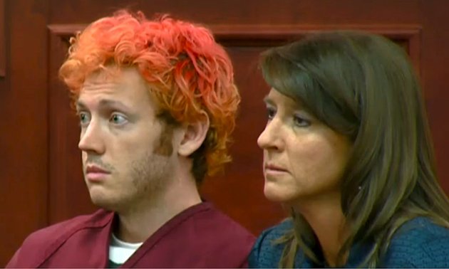 in-this-image-taken-from-video-provided-by-kusacom-james-holmes-left-the-suspected-gunman-the-aurora-colo-theater-massacre-makes-his-first-appearance-in-court-with-his-attorney-tamara-brady-in-centennial-colo-on-monday-july-23-2012