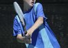 Riley McGill, 15, of Rogers, returns a ball Friday while playing a doubles match in the Nestle Tennis Tournament at Memorial Park in Bentonville.