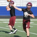 Drew Harris, right, and Dakota Riggin, Lincoln quarterback candidates, warm up before an NWA Passing...