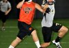 Gravette’s Peyton Rose, left, looks for a pass in a VYPE 7-on-7 game against Bentonville at Tiger Athletic Complex in Bentonville on Friday.