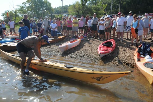 Herbert demonstrates one way to get into a kayak.