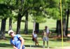 Tyler Green, of Benton, watches his ball after dhe chipped onto the green of the 11th hole in the finals for the ASGA Boys Junior Match Play golf at Eagle Hill Golf and Athletic Club in Little Rock Thursday.