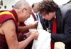 Billy Fleming speaks with the Dalai Lama on the University of Arkansas at Fayetteville campus in May 2011. 