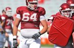 Junior center Travis Swanson is set to be the starting center for the Arkansas Razorbacks this season, but coaches Paul Petrino and Chris Klenakis said the other offensive line positions must be won through competition.