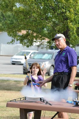 
                           Stephen Cox with Mad Science of Arkansas launches Audrey Behar's rocket.
