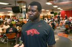 University of Arkansas football player Otha Peters talks to reporters during the Razorbacks team dinner at the Raymond Miller Room at the Broyles Complex at the University of Arkansas in Fayetteville.