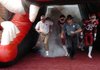 Capt. Lance King runs onto the field with former Arkansas football coach Bobby Petrino prior to a game in 2008. Arkansas State Police set new policies on Friday for troopers serving at sporting events. 