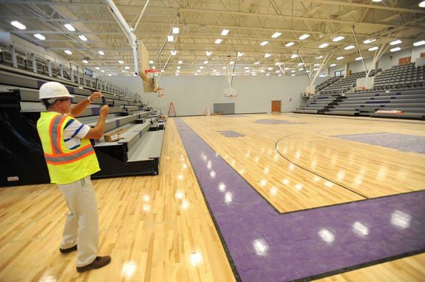 
                               
                                  Photo by Andy Shupe&mdash;
                               
                           
                           Officials walk through the gymnasium Thursday, Aug. 3, 2012, during a tour of the additions to the Fayetteville High School building.