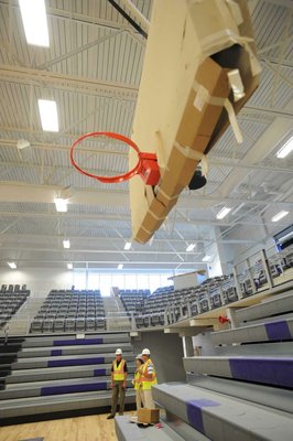 
                               
                                  Photo by Andy Shupe&mdash;
                               
                           
                           Officials walk through the gymnasium Thursday, Aug. 3, 2012, during a tour of the additions to the Fayetteville High School building.