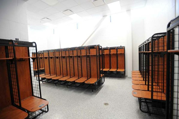 
                               
                                  Photo by Andy Shupe&mdash;
                               
                           
                           Officials walk through the locker rooms Thursday, Aug. 3, 2012, during a tour of the additions to the Fayetteville High School building.