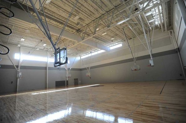 
                               
                                  Photo by Andy Shupe&mdash;
                               
                           
                           Officials walk through the auxiliary gymnasium Thursday, Aug. 3, 2012, during a tour of the additions to the Fayetteville High School building.