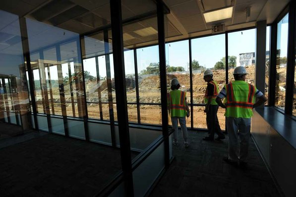 
                               
                                  Photo by Andy Shupe&mdash;
                               
                           
                           Officials walk through the offices Thursday, Aug. 3, 2012, during a tour of the additions to the Fayetteville High School building.
