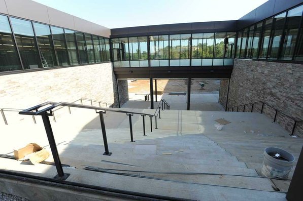 
                               
                                  Photo by Andy Shupe&mdash;
                               
                           
                           Officials walk through the main entrance Thursday, Aug. 3, 2012, during a tour of the additions to the Fayetteville High School building.
