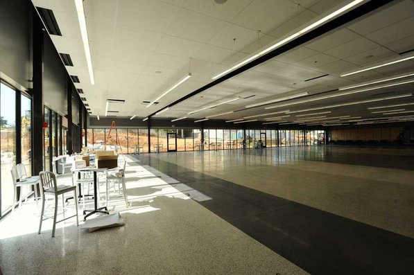 
                               
                                  Photo by Andy Shupe&mdash;
                               
                           
                           Officials walk through the cafeteria Thursday, Aug. 3, 2012, during a tour of the additions to the Fayetteville High School building.
