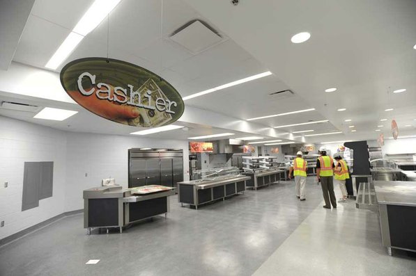 
                               
                                  Photo by Andy Shupe&mdash;
                               
                           
                           Officials walk through the cafeteria Thursday, Aug. 3, 2012, during a tour of the additions to the Fayetteville High School building.