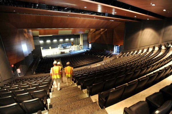 
                               
                                  Photo by Andy Shupe&mdash;
                               
                           
                           Officials walk through the auditorium Thursday, Aug. 3, 2012, during a tour of the additions to the Fayetteville High School building.