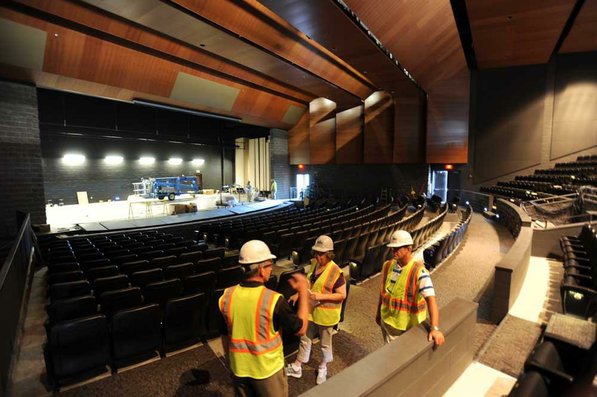 
                               
                                  Photo by Andy Shupe&mdash;
                               
                           
                           Officials walk through the auditorium Thursday, Aug. 3, 2012, during a tour of the additions to the Fayetteville High School building.