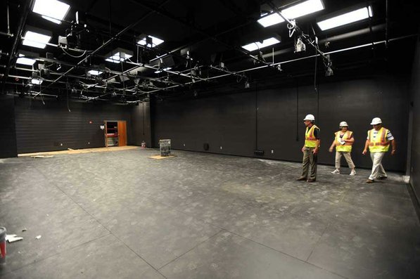 
                               
                                  Photo by Andy Shupe&mdash;
                               
                           
                           Officials walk through the blackbox theater Thursday, Aug. 3, 2012, during a tour of the additions to the Fayetteville High School building.