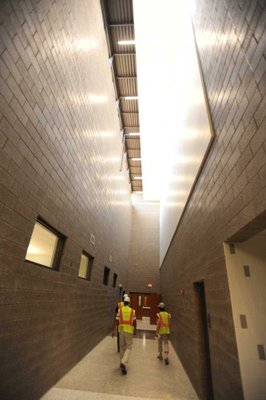 
                               
                                  Photo by Andy Shupe&mdash;
                               
                           
                           Officials walk through the hallways Thursday, Aug. 3, 2012, during a tour of the additions to the Fayetteville High School building.