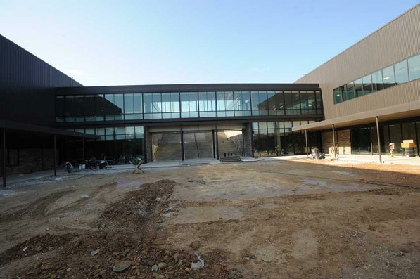 
                               
                                  Photo by Andy Shupe&mdash;
                               
                           
                           Officials walk through the main entrance Thursday, Aug. 3, 2012, during a tour of the additions to the Fayetteville High School building.