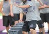 Fayetteville players run past obstacles Thursday during practice at Harmon Field.