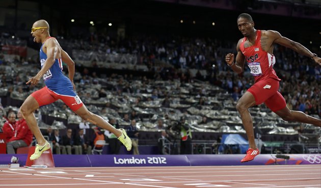 dominican-republics-felix-sanchez-left-crosses-the-finish-line-to-win-ahead-of-united-states-michael-tinsley-in-the-mens-400-meter-hurdles-final-during-the-athletics-in-the-olympic-stadium-at-the-2012-summer-olympics-london-monday