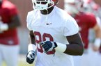 Arkansas defensive end Brandon Lewis, a two-sport athlete in high school, decided to concentrate on football on the advice of his coach.

